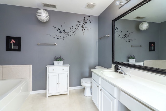 2276 Vanderbilt Dr Unit 2276, Geneva, IL 60134 - bathroom featuring a garden tub, vanity, toilet, baseboards, and tile patterned floors