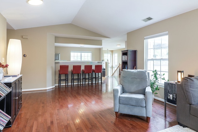 2276 Vanderbilt Dr Unit 2276, Geneva, IL 60134 - living area with wood finished floors, lofted ceiling, and baseboards