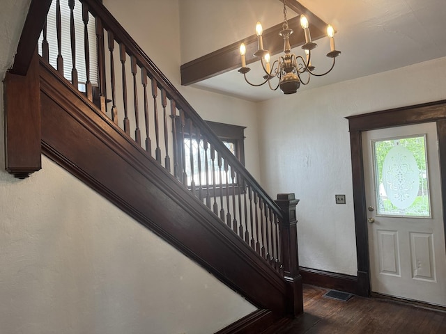 509 N Quincy St, Clinton, IL 61727 - foyer featuring wood finished floors, a chandelier, stairway, and baseboards
