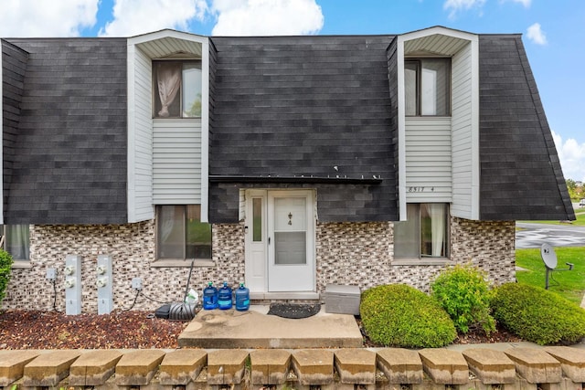 8517 Steven Pl Unit 4, Tinley Park, IL 60477 - view of front of house featuring brick siding and roof with shingles