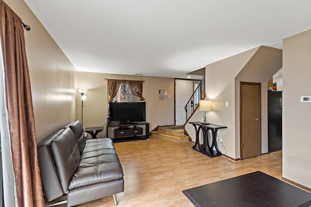 8517 Steven Pl Unit 4, Tinley Park, IL 60477 - living room featuring light wood-style floors, stairs, and baseboards