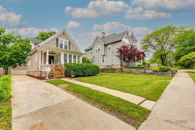 71 S Chestnut St, Aurora, IL 60506 - bungalow-style home featuring an outbuilding, a front yard, covered porch, and a chimney