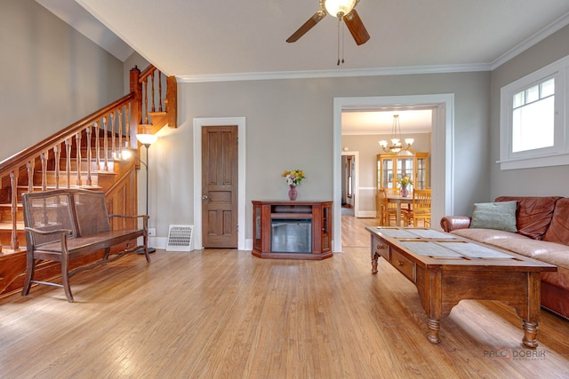 71 S Chestnut St, Aurora, IL 60506 - living area featuring stairway, light wood-type flooring, a ceiling fan, ornamental molding, and a fireplace