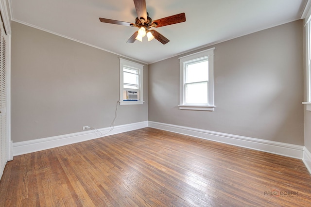 71 S Chestnut St, Aurora, IL 60506 - unfurnished room with wood finished floors, a ceiling fan, baseboards, and ornamental molding
