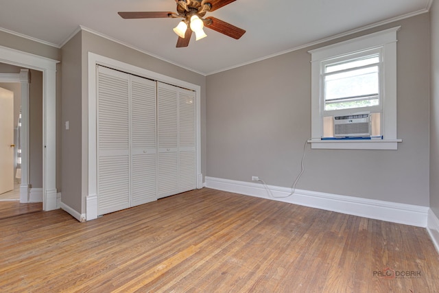 71 S Chestnut St, Aurora, IL 60506 - unfurnished bedroom featuring light wood-type flooring, a closet, baseboards, crown molding, and a ceiling fan