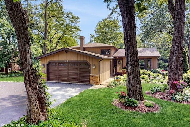 26W029 Hazel Ln, Wheaton, IL 60187 - view of front of house featuring a garage, driveway, a front yard, and brick siding