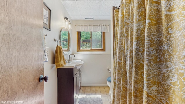 26W029 Hazel Ln, Wheaton, IL 60187 - bathroom with tile patterned flooring, vanity, and a drop ceiling