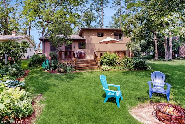 26W029 Hazel Ln, Wheaton, IL 60187 - back of house with a fire pit, a wooden deck, and a yard