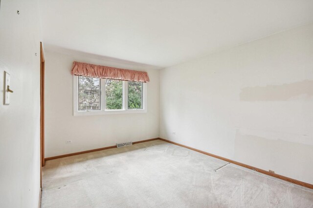 7913 Grant St, Darien, IL 60561 - carpeted spare room featuring baseboards