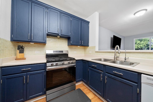 410 Cobblestone Ct, Oswego, IL 60543 - kitchen featuring stainless steel gas stove, blue cabinetry, a sink, and dishwasher