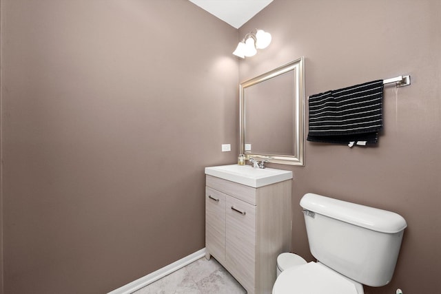 410 Cobblestone Ct, Oswego, IL 60543 - bathroom with toilet, vanity, marble look tiles, and baseboards