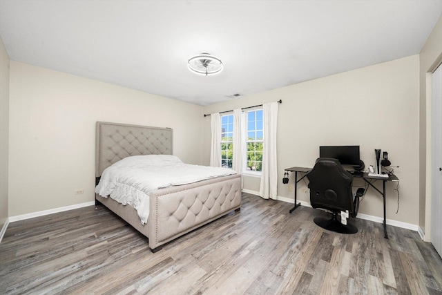 410 Cobblestone Ct, Oswego, IL 60543 - bedroom featuring wood finished floors, a desk, and baseboards
