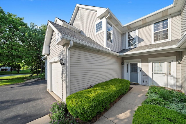 410 Cobblestone Ct, Oswego, IL 60543 - view of exterior entry with driveway and a garage