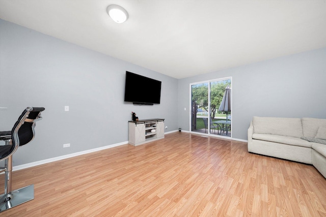 410 Cobblestone Ct, Oswego, IL 60543 - living room with light wood finished floors and baseboards