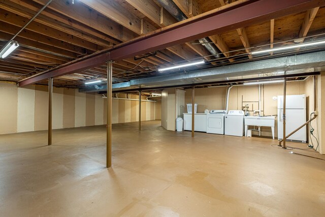 1140 Bristlecone Ct Unit 1140, Darien, IL 60561 - basement with washing machine and dryer, freestanding refrigerator, and a sink