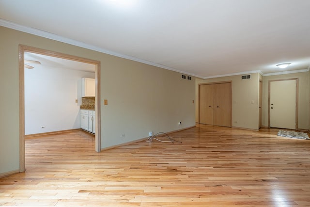 1140 Bristlecone Ct Unit 1140, Darien, IL 60561 - empty room featuring light wood-type flooring, ornamental molding, and baseboards