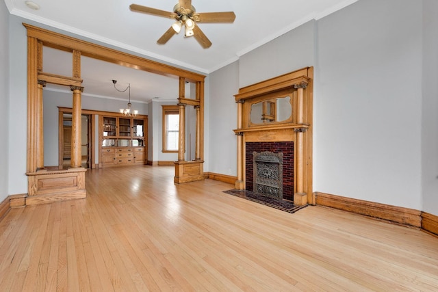 2533 N Kimball Ave, Chicago, IL 60647 - unfurnished living room featuring ornamental molding, hardwood / wood-style flooring, baseboards, a chandelier, and a ceiling fan
