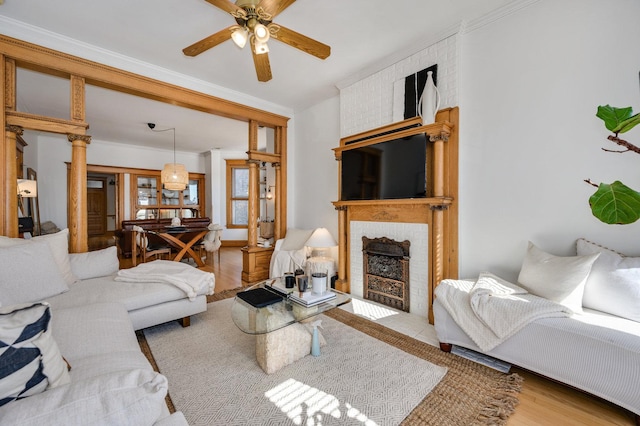 2533 N Kimball Ave, Chicago, IL 60647 - living room with crown molding, a ceiling fan, a brick fireplace, and wood finished floors