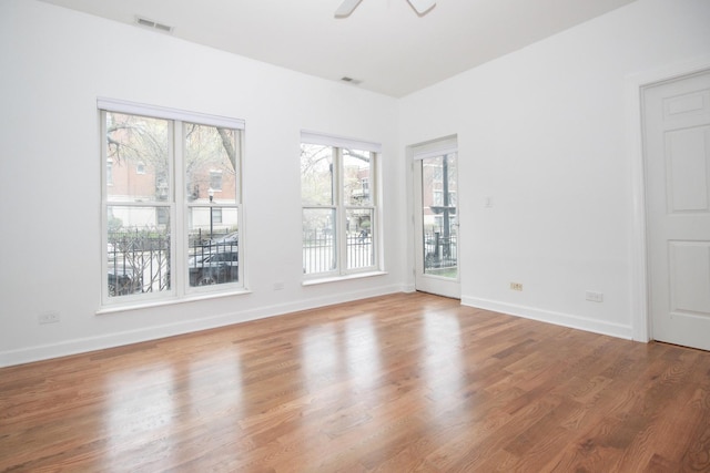 1500 S Halsted St Unit 1B, Chicago, IL 60607 - unfurnished room featuring wood finished floors, ceiling fan, and baseboards