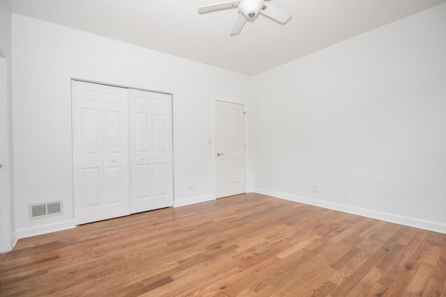 1500 S Halsted St Unit 1B, Chicago, IL 60607 - unfurnished bedroom with light wood-style floors, baseboards, a closet, and a ceiling fan