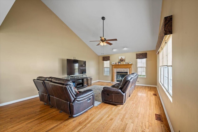 323 Valley Forge Ave, South Elgin, IL 60177 - living area featuring a fireplace, high vaulted ceiling, baseboards, a ceiling fan, and light wood-style flooring