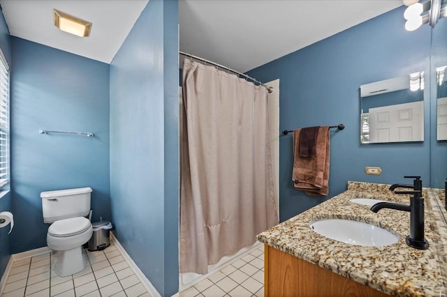 323 Valley Forge Ave, South Elgin, IL 60177 - bathroom featuring toilet, vanity, a shower with shower curtain, and tile patterned floors