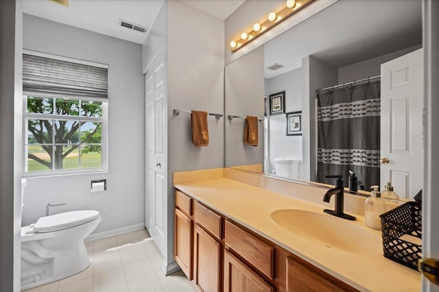 323 Valley Forge Ave, South Elgin, IL 60177 - full bath with toilet, vanity, baseboards, and tile patterned floors