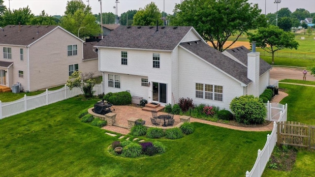 323 Valley Forge Ave, South Elgin, IL 60177 - rear view of house featuring an outdoor fire pit, a chimney, a patio, central AC unit, and a shingled roof