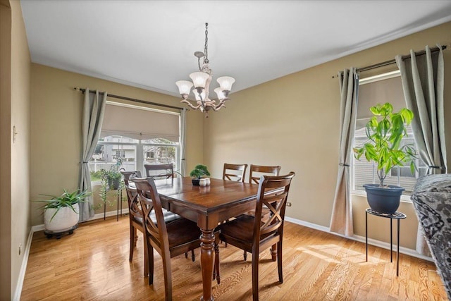 323 Valley Forge Ave, South Elgin, IL 60177 - dining space with a chandelier, light wood-style floors, and baseboards