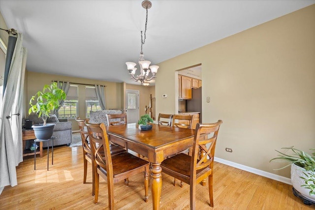 323 Valley Forge Ave, South Elgin, IL 60177 - dining area with light wood-style floors, a chandelier, and baseboards