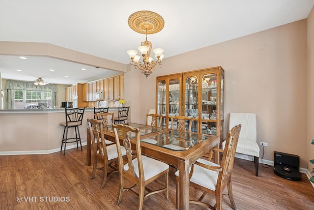 319 Capital Dr, Shorewood, IL 60404 - dining room with a chandelier, wood finished floors, and recessed lighting