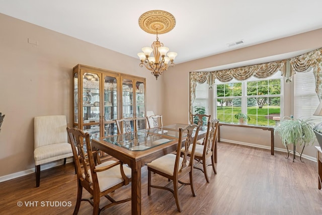 319 Capital Dr, Shorewood, IL 60404 - dining space featuring a chandelier and wood finished floors
