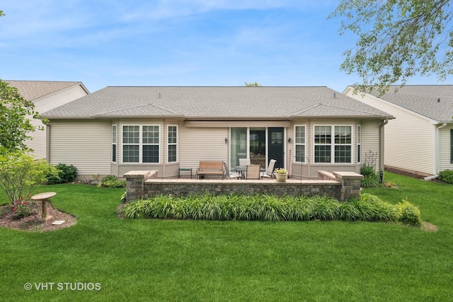 319 Capital Dr, Shorewood, IL 60404 - back of house featuring a patio, a yard, and a shingled roof