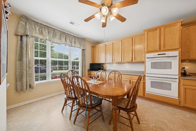 319 Capital Dr, Shorewood, IL 60404 - dining area with baseboards and a ceiling fan
