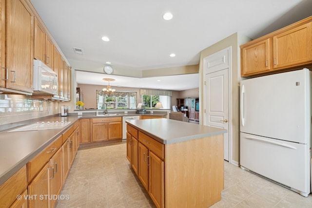 319 Capital Dr, Shorewood, IL 60404 - kitchen with white appliances, a peninsula, recessed lighting, a center island, and light tile patterned flooring