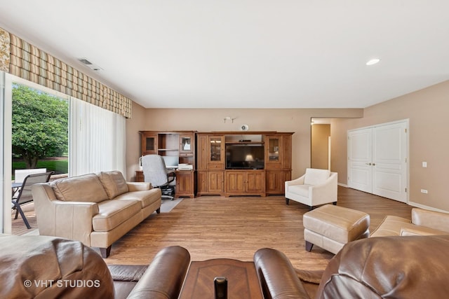 319 Capital Dr, Shorewood, IL 60404 - living area featuring light wood-style floors and baseboards