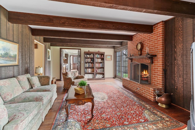 1200 Winwood Dr, Lake Forest, IL 60045 - living room featuring hardwood / wood-style flooring, a brick fireplace, beamed ceiling, and wooden walls