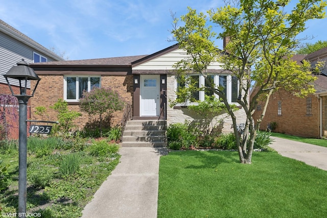 1225 Morgan Ave, La Grange Park, IL 60526 - view of front facade with a front yard and brick siding