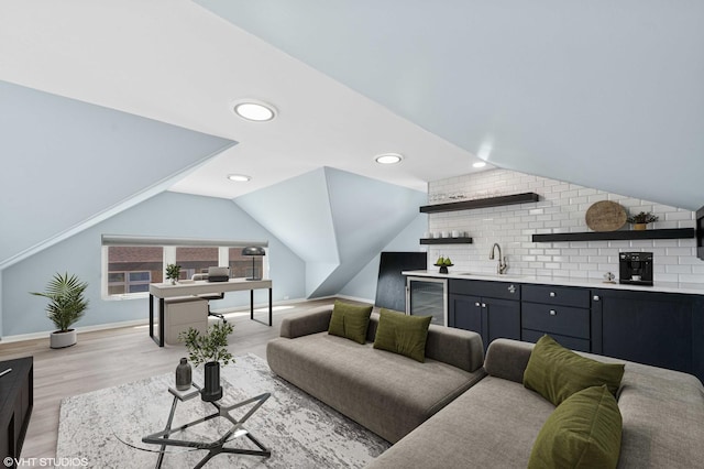 1225 Morgan Ave, La Grange Park, IL 60526 - living area featuring wine cooler, vaulted ceiling, bar with sink, light wood finished floors, and recessed lighting