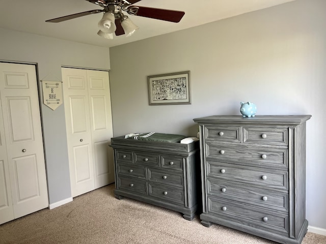 7 Ivy Ct, South Elgin, IL 60177 - bedroom with light carpet, ceiling fan, and two closets