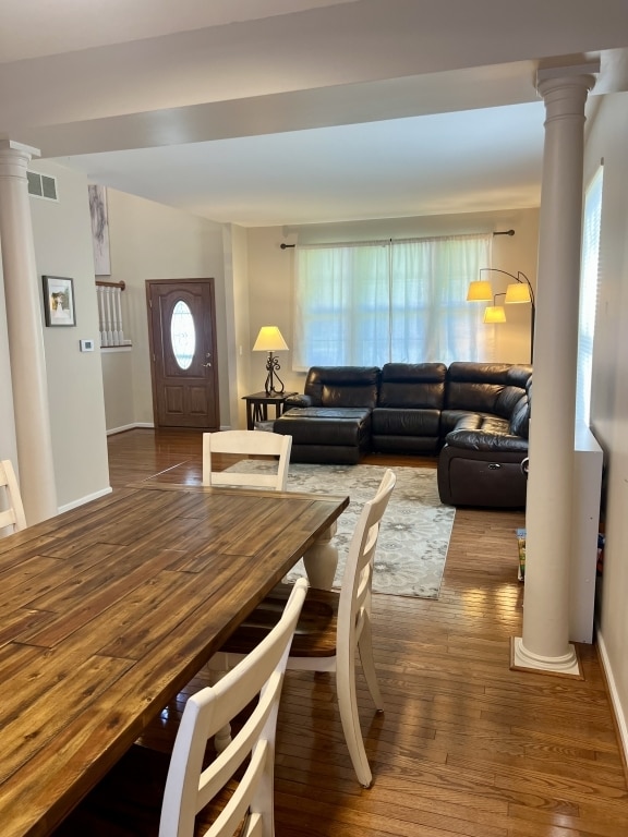 7 Ivy Ct, South Elgin, IL 60177 - dining space featuring ornate columns and wood-type flooring