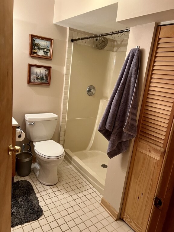 7 Ivy Ct, South Elgin, IL 60177 - bathroom with a walk in shower and tile patterned floors