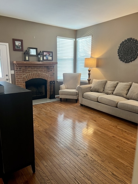 7 Ivy Ct, South Elgin, IL 60177 - living room with a fireplace, wood-type flooring, and healthy amount of natural light