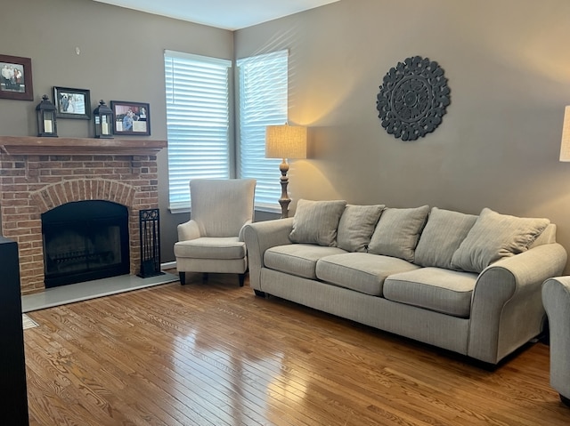 7 Ivy Ct, South Elgin, IL 60177 - living room featuring hardwood / wood-style floors and a brick fireplace