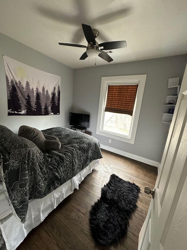 2009 W Garfield Blvd, Chicago, IL 60636 - bedroom featuring wood finished floors, baseboards, and a ceiling fan