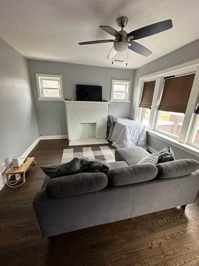 2009 W Garfield Blvd, Chicago, IL 60636 - living area featuring baseboards, plenty of natural light, ceiling fan, and wood finished floors