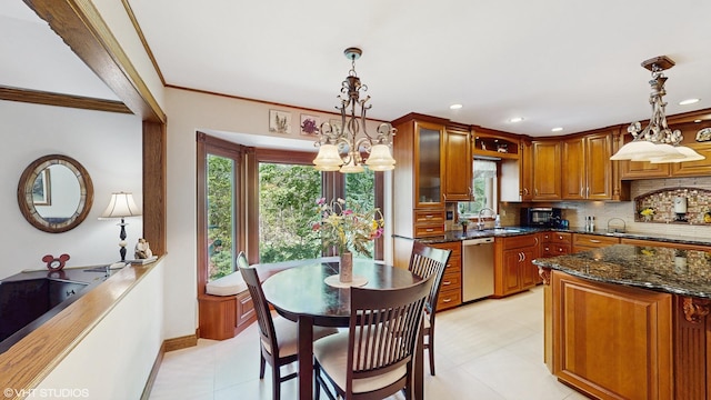 4445 Brittany Dr, Lisle, IL 60532 - kitchen featuring stainless steel dishwasher, decorative backsplash, dark stone countertops, baseboards, and brown cabinetry
