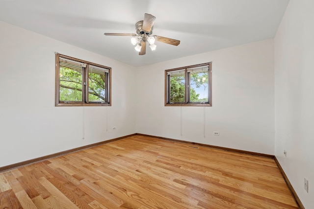 8862 167th St, Orland Hills, IL 60487 - spare room with baseboards, light wood-type flooring, and a ceiling fan