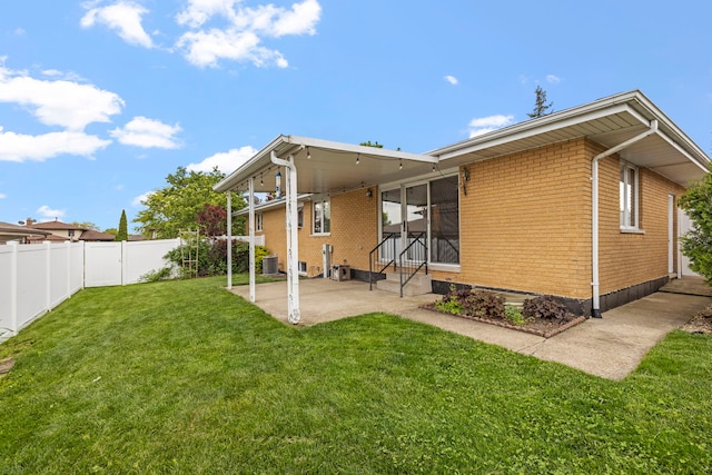 8862 167th St, Orland Hills, IL 60487 - back of property with brick siding, a patio, entry steps, and central AC