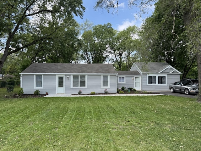 2407 Burbank St, Joliet, IL 60435 - ranch-style house with a front yard